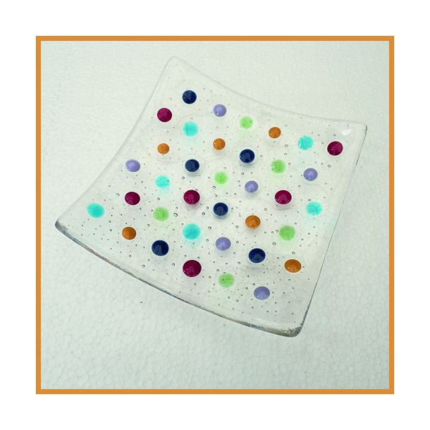 Clear dish with coloured spots